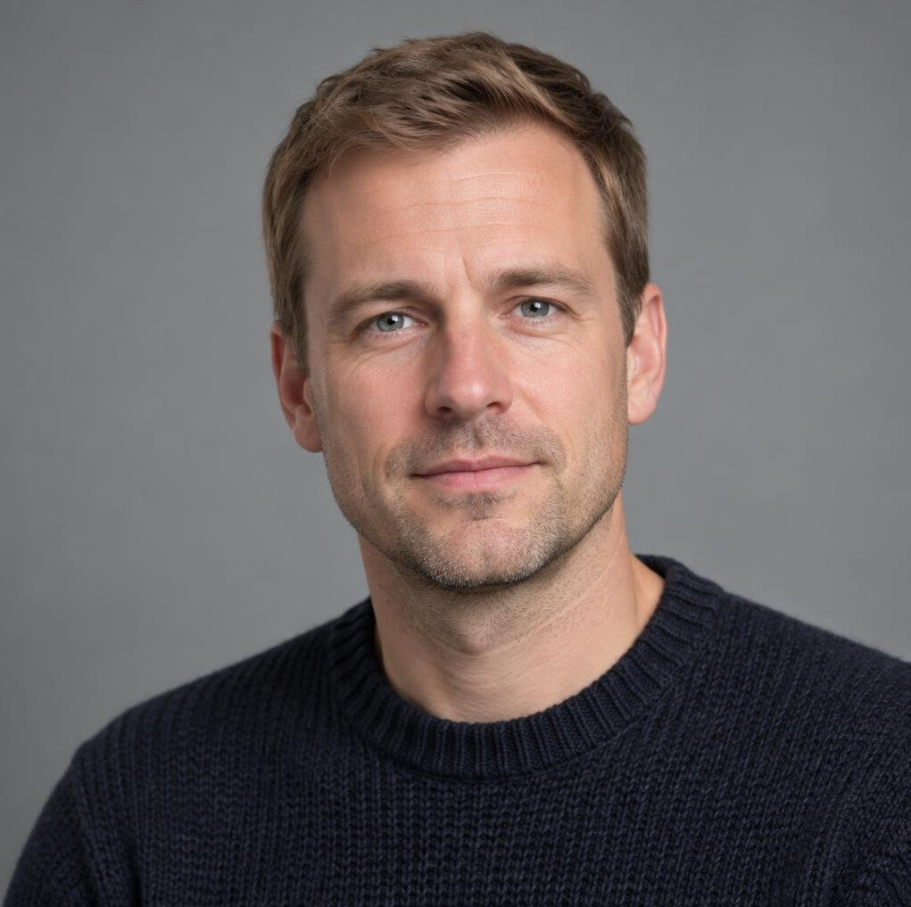 Portrait of a man with short hair in a dark shirt